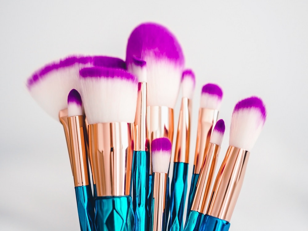 How and how often should makeup brushes be washed?